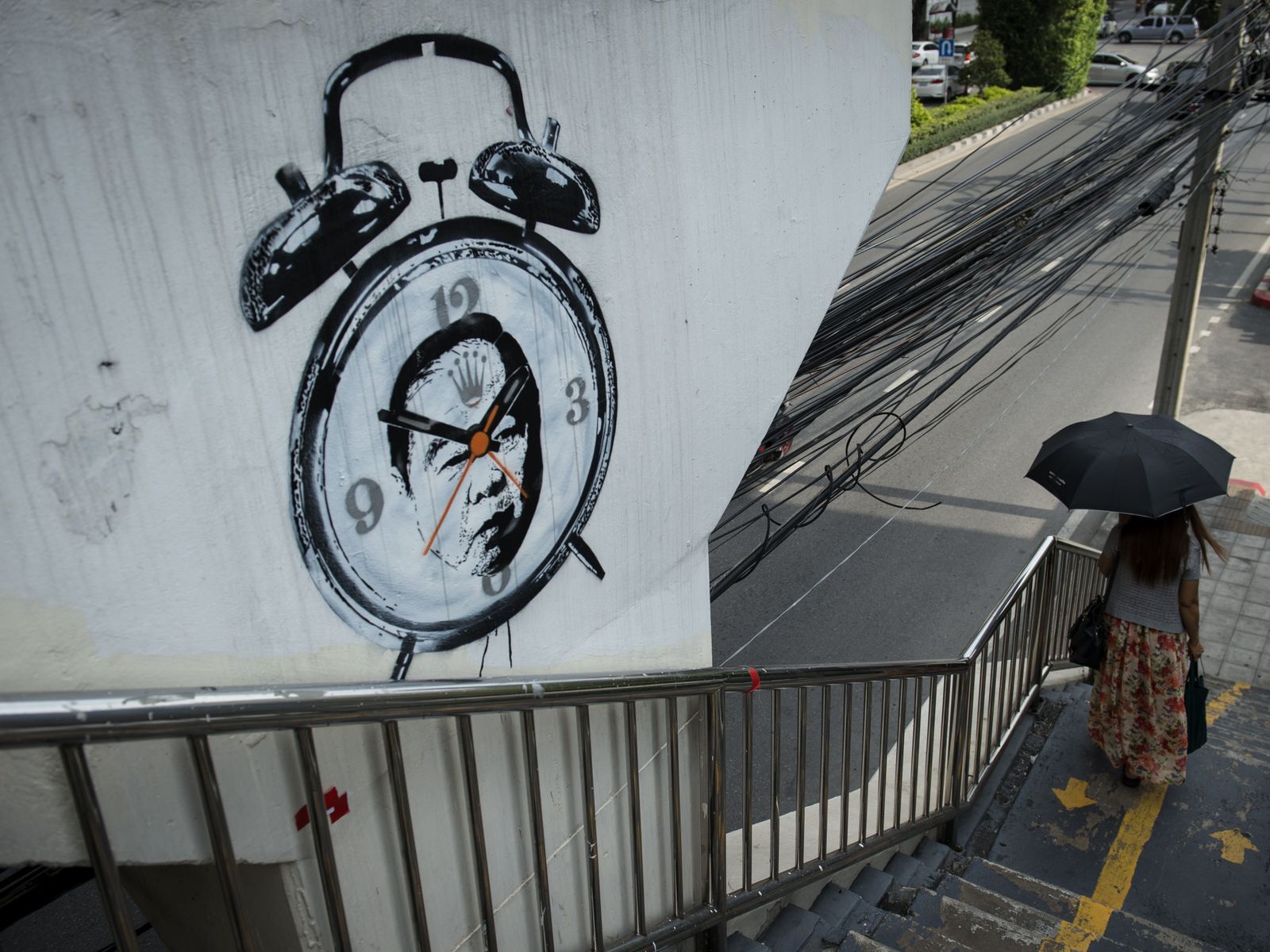 Thai artist faces harrasment from security officials over anti-government cartoons